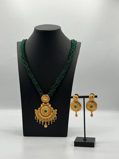 Complete your look with this exquisite 24k gold-plated necklace and earring set, beautifully adorned with vibrant green hydro potey stones. Designed to exude elegance and sophistication, this set is ideal for weddings, special occasions, or adding a luxurious touch to your everyday style. The intricate craftsmanship and rich gold plating make it a standout piece that pairs beautifully with traditional or contemporary outfits. Green Temple Jewelry For Celebration, Green Temple Jewelry Sets For Gifts, Green Round Temple Jewelry Bridal Necklace, Green Round Temple Necklace, Green Round Temple Style Necklace, Green Temple Jewelry As Gift, Green Temple Jewelry For Gifts, Traditional Green Jewelry Sets As A Gift, Traditional Green Emerald Necklace For Celebration