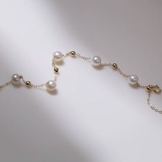 Carefully selected 6-7 Aurora freshwater pearls sparkle like light bulbs, have a classic beauty and add brilliance to the neck. Made from a 14K cast gold chain, this necklace is durable and has 14K gold certification. Simplicity and subtlety are key, no need for fancy beading or extra playfulness for a soft touch. Wear alone or layered for a trendy and versatile look Metal: 14K Gold Filled Gemstone: Freshwater Pearls Pearl Diameter: 6-7mm Length: 14-18mm Weight: 1.7g Gold Pearl Bracelet With 14k Gold Chain, Elegant 14k Gold-filled Yellow Gold Pearl Necklace, 14k Yellow Gold Pearl Bracelet With Charm, Elegant Pearl Chain Bracelet In 14k Gold Filled, Elegant 14k Gold-filled Pearl Bracelet, Elegant 14k Yellow Gold Filled Pearl Bracelet, Elegant Yellow Gold 14k Gold-filled Pearl Bracelet, Elegant Yellow Gold 14k Gold Filled Pearl Bracelet, Bracelets Pearl