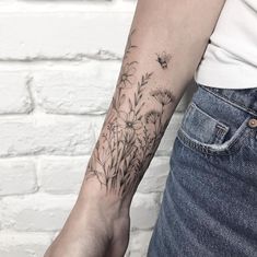 a person with a tattoo on their arm