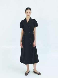 This is a trendy and modern dress by MOHAN that is made out of high quality and sturdy material. With distinctive mood of the design and comfortable wear, you can style it for your casual daily outfit.- Tailored collar and double buttons- Shirring and puff sleeves detail- Minimal and feminine mood Short Sleeve Midi Dress With Button Cuffs For Work, Short Sleeve Midi Dress With Buttons For Office, Chic Short Sleeve Midi Dress With Button Closure, Casual Buttoned Midi Dress For Semi-formal Occasions, Casual Buttoned Midi Dress For Semi-formal Events, Semi-formal Short Sleeve Midi Dress With Buttons, Short Sleeve Midi Dress With Buttons For Semi-formal, Short Sleeve Midi Dress With Buttons For Semi-formal Occasion, Elegant Short Sleeve Shirt Dress With Covered Buttons