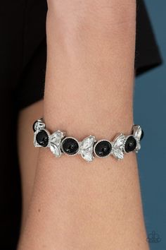 Paparazzi Accessories- Opulent Oasis - Black  Bracelet Item #P9RE-BKXX-265XX   Encrusted in dazzling white rhinestones and an oversized black bead, leafy silver frames are threaded along stretchy bands around the wrist for a timeless look.   Sold as one individual bracelet. Paparazzi Jewelry Images, Paparazzi Accessories Jewelry, Parties Ideas, Black Bracelet, Silver Frames, Silver Chains, Black Bracelets, Paparazzi Accessories, Stretchy Bracelets