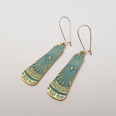 Bold blue patina brass hammered sun burst drop earrings, with matte gold plated or gold filled ear wires. I think they have an Egyptian style to them. The bar shape measures 1 3/4 inches (45 mm) from top to bottom. They are mid weight earrings. They come on kidney wires, but if you would like a different wire please ask me. These earrings come in a gift box. More earrings here: http://etsy.me/28JtZ7G Earring Inspo, Sun Burst, Egyptian Style, Bar Jewelry, Unusual Earrings, Egyptian Jewelry, Gold Sun, Jewellery Ideas, Textile Jewelry