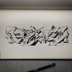 a black and white drawing of graffiti on paper