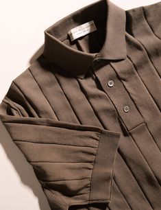 This item is FINAL SALE and not eligible for returns or exchanges. Filippo de Laurentiis' designers are true masters of their knitwear craft, as well as experts in effortless refinement. This knit polo in crepe cotton with ribbing is no exception. Compared to the polos we all know with alligators or polo players on their chest, this model has a distinctly more sophisticated air about it. The crisp crepe cotton is knit from a super fine gauge yarn that feels so cool and breathable on the skin, wh Classic Gray Tops With Ribbed Collar, Designer Collared Brown Top, Designer Brown Collared Top, Classic Brown Fine Knit Top, Classic Brown Merino Wool Top, Fitted Brown Merino Wool Tops, Polo Players, Shorts Sweatpants, Tuxedo Shirts