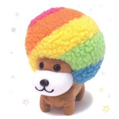 a small stuffed dog wearing a rainbow colored knitted hat on top of it's head