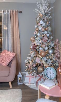 a pink christmas tree in a living room