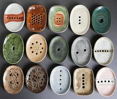 nine ceramic plates with holes and designs on them