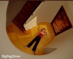 a woman laying on the floor in a room