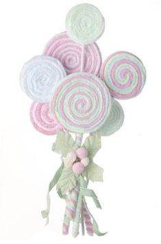 a bunch of lollipops sitting on top of each other in a bouquet