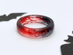 ⭐CHRISTMAS LAST POSTAGE: DEC 10 ⭐ The holiday season is here, and we want to ensure your gifts arrive in time for Christmas! Please place your orders before December 10th as orders after this date may not arrive in time for Christmas!  ❤️ Blood Red Resin Ring  ❤️ A vampire-inspired resin ring with black and red swirling resin. ✨ Perfect for your witchy-halloween outfits, or just regular dark academia inspired fits 🩸 matching jewelry is available on my page 🪄 These are lovingly handmade to orde Red Rings For Halloween Gift, Black And Red Rings, Vampire Rings, Blood Ring, Vampire Ring, Bff Wedding, Vampire Fashion, Witchy Gifts, Witchy Halloween