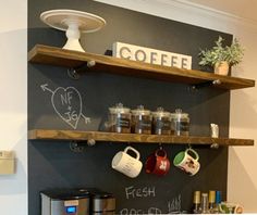 the coffee bar has two shelves with cups on them