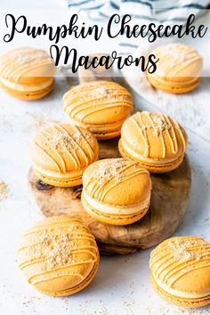 pumpkin cheesecake macarons on a wooden plate