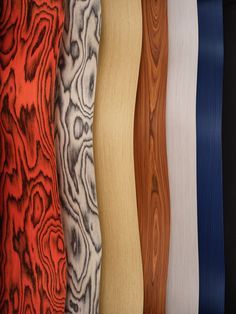 an assortment of different colored woodgrains in varying sizes and colors, all lined up together