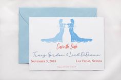 save the date card with two brides in blue gowns and red lettering on it