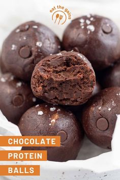 chocolate protein balls stacked on top of each other in a white bowl with text overlay