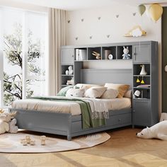 a child's bedroom with grey furniture and toys on the floor in front of a window