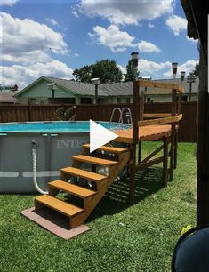 an above ground swimming pool with steps leading up to the deck and above ground hot tub