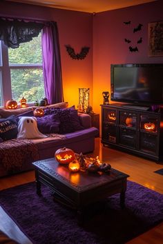 a living room decorated for halloween with pumpkins on the coffee table and purple curtains