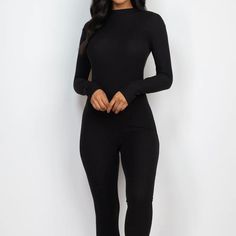 This black jumpsuit features a sleek skinny leg design, perfect for elongating the body and creating a slimming silhouette. Made with high-quality fabric, it provides both comfort and style for a versatile and put-together look. Black Stretch Jumpsuits And Rompers In Elastane, Sleek Black Stretch Jumpsuits And Rompers, Sleek Stretch Solid Jumpsuits And Rompers, Sleek Black Elastane Jumpsuits And Rompers, Black High Stretch Full Length Jumpsuits And Rompers, High Stretch Black Full-length Jumpsuits And Rompers, Sleek Black Jumpsuits For Night Out, Sleek Black Long Sleeve Jumpsuits And Rompers, Chic Long Sleeve Jumpsuits In Elastane