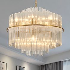 a chandelier hanging from the ceiling in a living room