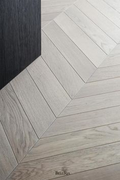 an image of wood flooring that looks like herringbones or chevron lines