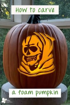 a carved pumpkin with the word how to carve on it and a skull in the center