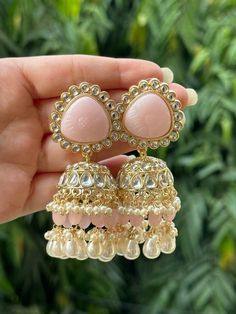 Luxury White Jhumkas With Latkans, Luxury Fusion Style Chandelier Earrings With Latkans, Luxury Hallmarked Fusion Jhumkas, Luxury Tilla Jhumkas For Eid, Cheap Jhumkas For Diwali Celebration, Luxury Ornate Jhumkas For Festivals, Luxury Jhumkas With Stone Work For Festivals, Luxury Hand Set Jhumkas For Diwali, Luxury Multicolor Fusion Jhumkas