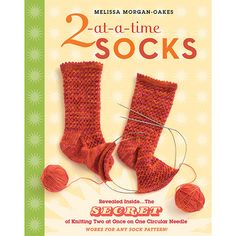 the book has two knitted socks and yarns on it's front cover