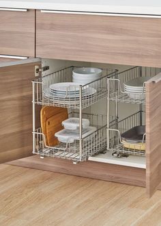 an open dish rack with dishes in it