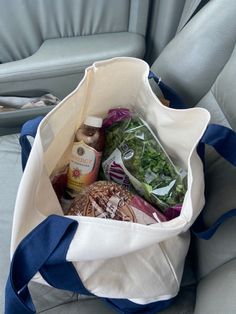 a bag filled with food sitting on top of a seat