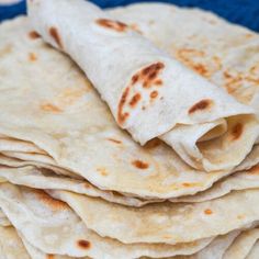 some tortillas are stacked on top of each other