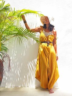 "V Neck Yellow Mustard Jumpsuit for Women 🌟 Your next Favorite Jumpsuit: - Material: Crafted from 100% natural cotton fabric, this stunning piece isn't just beautiful but also incredibly breathable, ideal for the warmer months. 📏 Sizing: Tailored to fit XS to XXL / US: 2/4/6/8/10/12/14/16/18/20 Free length alterations available--just message us before your purchase! 🙏 🌹 Description: - Comfortable Flow: With approximately 4 meters of flowy fabric, it drapes beautifully, ensuring a flattering silhouette. The skinny adjustable tie strap and super wide asymmetrical legs provide both style and comfort. - Versatile Style: Dress it up or down by accessorizing with a belt, vest, or jacket.  - Perfect for Any Occasion: From casual day outs to special nights, this jumpsuit suits every scenario. Beach Jumpsuits And Rompers With Adjustable Straps, Summer Vacation Jumpsuits And Rompers With Belt, Sleeveless Summer Overalls With Tie Straps, Summer Sleeveless Overalls With Tie Straps, Summer Sleeveless Jumpsuits And Rompers With Tie Straps, Summer Sleeveless Jumpsuits With Tie Straps, Chic Beach Jumpsuits And Rompers With Adjustable Straps, Sleeveless Solid Overalls For The Beach, Sleeveless Jumpsuits And Rompers With Tie Straps For Vacation