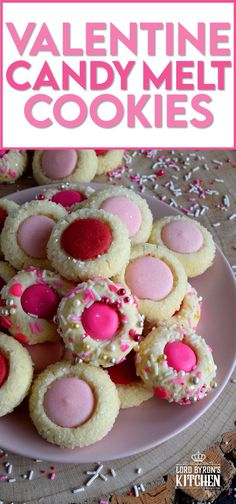 valentine candy melt cookies on a plate with sprinkles and pink frosting