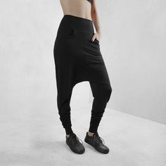 Edgy, cool streetwear style, black harem pants made from certified organic cotton with 10% lycra for comfort, fit and durability. These have a comfy set of side pockets, and a loose fit around the hips and extra volume at the ankle making these the perfect pair of pants for any body type or yoga, lounging, or night life. Totally versatile - create your look based on your need or situation. This cut flatters every body type with a relaxed, edgy, streetwear fit. Look fly AF but basically wearing y Baggy Wide Leg Harem Pants Hip Hop Style, Baggy Wide Leg Hip Hop Harem Pants, Baggy High Waist Hip Hop Sweatpants, High Waist Baggy Hip Hop Sweatpants, Black Full Length Parachute Pants With Hip Pockets, Black Full-length Parachute Pants With Hip Pockets, Relaxed Fit Full-length Harem Pants For Streetwear, Black Harem Pants With Pockets For Streetwear, Black Hip Hop Harem Pants With Pockets