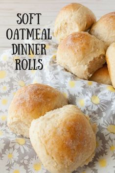 soft oatmeal dinner rolls on a floral napkin with the words, soft oatmeal dinner rolls