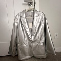 This Is A Brand New Never Worn New With Tags Silver, Shiny Sexy Vegan Leather Jacket From Target’s Recent Capsule Collection. It’s Lined And In Imperfect Condition. Looks Amazing With The Sleeves Rolled Up! Size Xl And Boxy. Very Roomy And Super On Trend Right Now! Perfect For The Holidays! Trendy Blazer With Pockets For Night Out, Metallic Outerwear For Work, Chic Metallic Outerwear For Work, Chic Metallic Outerwear For Night Out, Silver Leather Long Sleeve Jacket For Fall, Chic Long Sleeve Metallic Blazer, Chic Metallic Long Sleeve Blazer, Chic Fitted Metallic Blazer, Fitted Metallic Biker Jacket For Winter