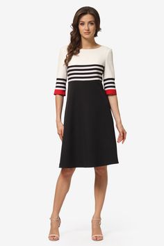 Dress with A-line silhouette, waistline seam, and 3/4 sleeves. The fabric is combined: stripes and solid color with contrasting inserts create unmatched elegance. For convenience, there's a zipper in the dress. The length of the garment varies from sizes 102 to 114 cm. The fabric composition includes natural viscose, which allows the fabric to breathe and feels pleasant to the touch. The fabric has slight stretch on one side. The front side is smooth, but a ribbed structure is visible up close. The suiting fabric is not transparent either on the body or in the light, so the garments do not require additional lining fabric. Composition: 65% polyester, 30% viscose, 5% spandex. Spring Workwear Dresses With Contrast Stripes, Contrast Stripe Dresses For Workwear, Striped Hem Dress For Work, Elegant Vertical Stripes Workwear Dress, Elegant Striped A-line Midi Dress, Striped A-line Lined Dress, Elegant Knee-length Dress With Vertical Stripes, Black Dresses With Contrast Stripes, Elegant Spring Dresses With Striped Hem