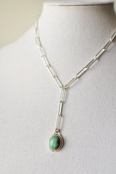 Delightful muted blue/green Hubei turquoise semiprecious gemstone reminds me of waves crashing onto the beach. This delicate oval is set in a simple handcrafted polished bright sterling silver setting and hangs from a large link sterling silver Y chain. Necklace is approximately 17"L with a 2"L drop of 3 links Pendant measures approximately 1"L x 5/8"W Large spring ring clasp .925 Sterling Silver Modern Turquoise Sterling Silver Jewelry, Sterling Silver Lariat Jewelry With Natural Stones, Minimalist Oval Jewelry With Silver Chain, Modern Oval Turquoise Jewelry, Modern Turquoise Oval Jewelry, Minimalist Oval Silver Chain Jewelry, Turquoise Sterling Silver Long Drop Jewelry, Sterling Silver Turquoise Necklace With Adjustable Chain, Turquoise Necklace With Natural Stones In Sterling Silver