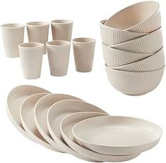 a set of white dishes and cups on a white background