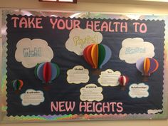 a bulletin board with hot air balloons and other information about the new heights on it