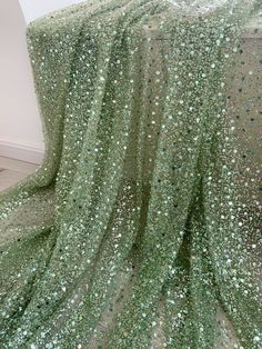 Light green bead lace fabric, sparkle French bead lace fabric with sequins, sequin fabric for dress, couture, costume ＭＡＴＥＲＩＡＬ bead lace fabric ＭＥＡＳＵＲＥＭＥＮＴ 47 inches in height, selling by per yard , we cut this fabric by hand, so please understand that may create a 1-3 inches tolerance. if you buy more, you will get a uncut piece~ ＣＯＬＯＲ   the sequins are matte , very elegant as you see from the picture  ＱＵＡＮＴＩＴＹ for bulk orders please convo me for discount ＦＥＡＴＵＲＥＳ * Designed by famous master specially for bridal accessories.  * Vivid and exquisite embroidery. * Soft and comfortable hand feel. * Ideal for Dress, wedding decors, party decor, costume .... Ｃｌｉｃｋ http://www.etsy.com/shop/LaceFun?section_id=11791836  ｆｏｒ ｍｏｒｅ ３Ｄ ｒｏｓｅ／ｆｌｏｗｅｒ ｂｌｏｓｓｏｍ ｔｒｉｍｓ！ ＴＨＡＮＫ ＹＯＵ ＳＯ ＭＵＣＨ， ＨＡＶＥ Ａ ＮＩＣＥ ＤＡＹ！ Sequence Fabric, Glitter Curtains, Diy Tulle, Bead Lace, Dress Couture, Beaded Lace Fabric, Tulle Flowers, Beaded Tulle, 3d Rose