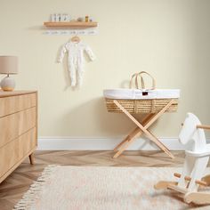 a baby's room with a rocking horse and crib