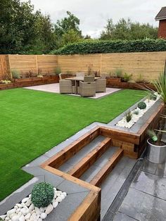 an outdoor area with grass and wooden steps