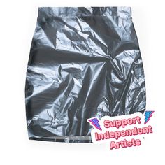 an image of a skirt that is made out of silver plastic wrapper and has the words support independent artists on it