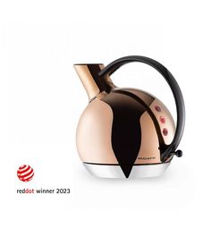 the red dot winner 2013 is an unusual tea kettle with a unique design on it