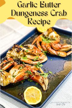 garlic butter dunggeness crab recipe with lemon wedges