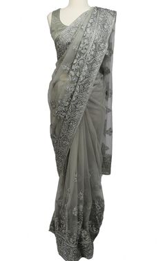 This dusty grey Saree makes a bold statement with tonal threadwork and shines with stone work throughout the Saree on an elegant net fabric.Top Length: 15Fabric: NetEmbroidery: Thread, StoneNote: Optional Sleeves Included Formal Unstitched Saree With Intricate Embroidery, Formal Saree With Intricate Embroidery For Eid, Elegant Silver Traditional Wear With Resham Embroidery, Designer Traditional Saree With Stone Work, Designer Gray Dupatta With Zari Work, Formal Saree Fabric With Intricate Embroidery, Elegant Dupatta With Stone Work In Traditional Drape, Elegant Net Dupatta With Intricate Embroidery, Semi-stitched Silver Traditional Wear With Resham Embroidery