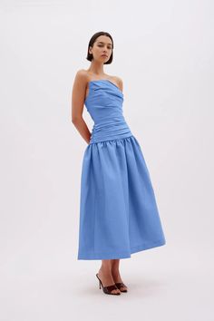 Iconic ruching fuses with ladylike pleating to define the Banks dress. Pictured in stretch-taffeta, it has a subtly asymmetric bodice before extending to a voluminous skirt. The strapless design will really mesmerise onlookers and party guests. Internal fitted bodice Asymmetrical neckline Gathered A-line midi skirt Fabric gathers at bust Back zip closure Runs true to size, we recommend taking your usual size. Model is 5'10 and wears a Rachel Gilbert Size 1 [AU/UK 8 | US 4] Voluminous Skirt, Rachel Gilbert, Balloon Pants, Asymmetrical Neckline, High Neck Sweater, Black Tie Wedding, Mid Dresses, Party Guests, Engineered Garments