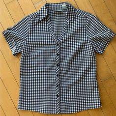 Beautiful Checkered Shirt-Sleeve Blouse, Very Nice Material And Never Used. Chic Short Sleeve Plaid Blouse, Plaid Fitted Blouse For Work, Fitted Plaid Blouse For Work, Plaid Short Sleeve Blouse For Work, Plaid Button-up Office Tops, Plaid Short Sleeve Tops For Work, Gingham Short Sleeve Blouse For Work, Gingham Button-up Blouse For Work, Short Sleeve Gingham Blouse For Work