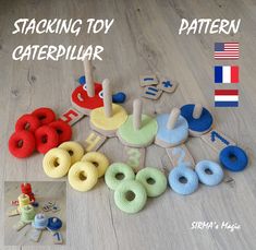 several knitted toys are laid out on the floor with words written in each one